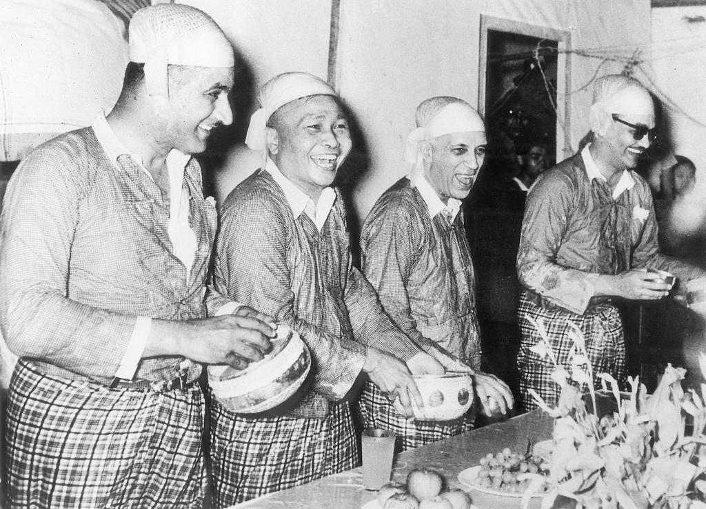 Nasser of Egypt (left), Nehru (2nd from the right), and an aide to Nasser, ushering in the Burmese New Year at Bandung, Indonesia, 1955.